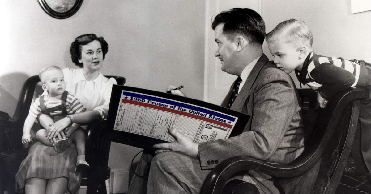 A census taker records a family's information in 1950